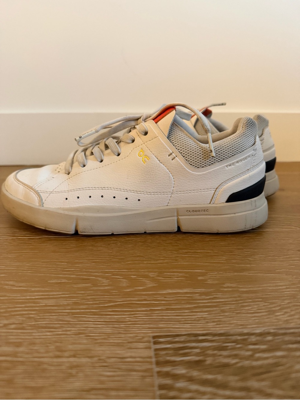 On Running The Roger Low-Top Sneakers in White with gold and orange details
